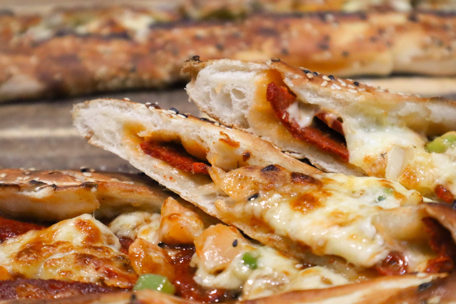 Traditional Turkish pide - wood-fired boat-shaped flatbread with various toppings at Weston Turkish Cuisine